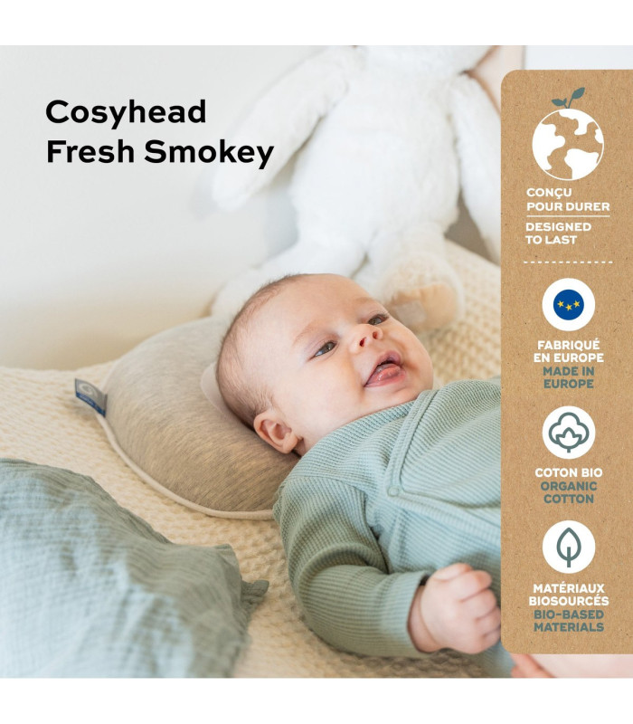Bebé boca arriba sobre el cojín anatómico Babymoov Cosyhead Fresh Smokey de algodón orgánico y Tencel