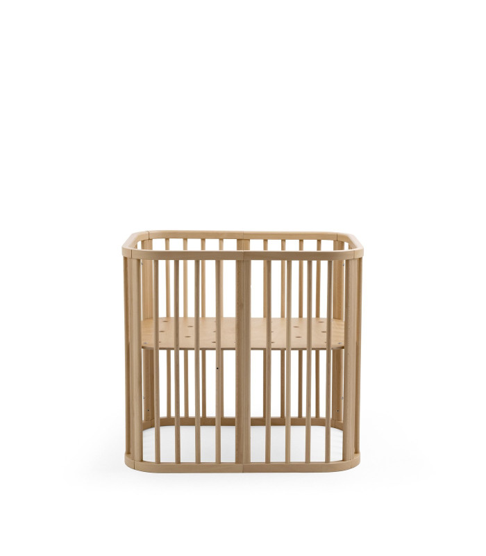 Stokke Nighti Mini Natural sin colchón, con el somier de madera a la vista